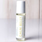 Hello Wellness Calm Belly aromatherapy essential oil roll-on in a clear glass bottle with a white cap, a soothing stomach blend.