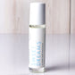 Hello Wellness Sweet Dreams aromatherapy essential oil roll-on in a clear glass bottle with a white cap, a restful night blend.