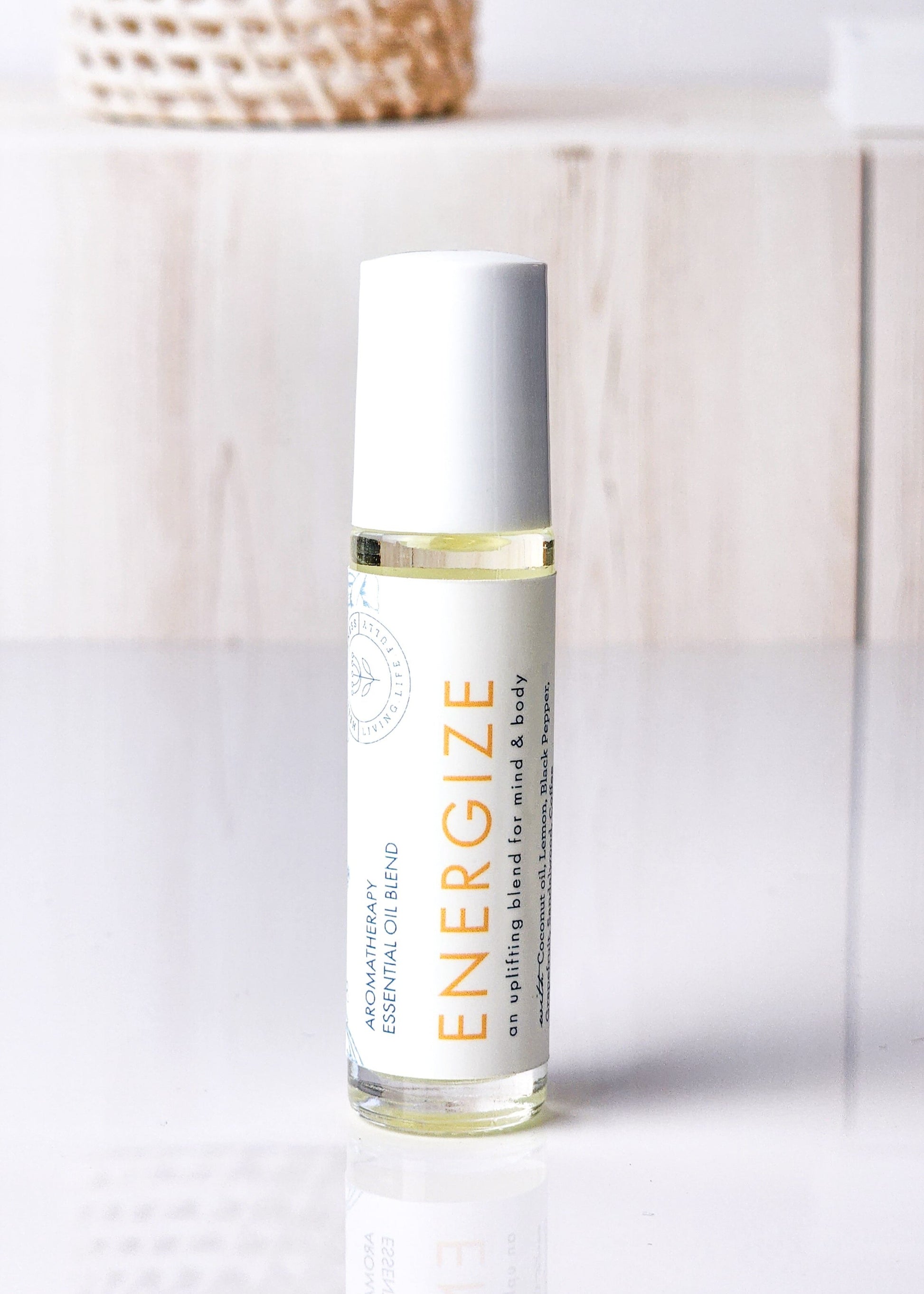 Roll-on bottle labeled 'Energize' for for boost without the caffeine crash