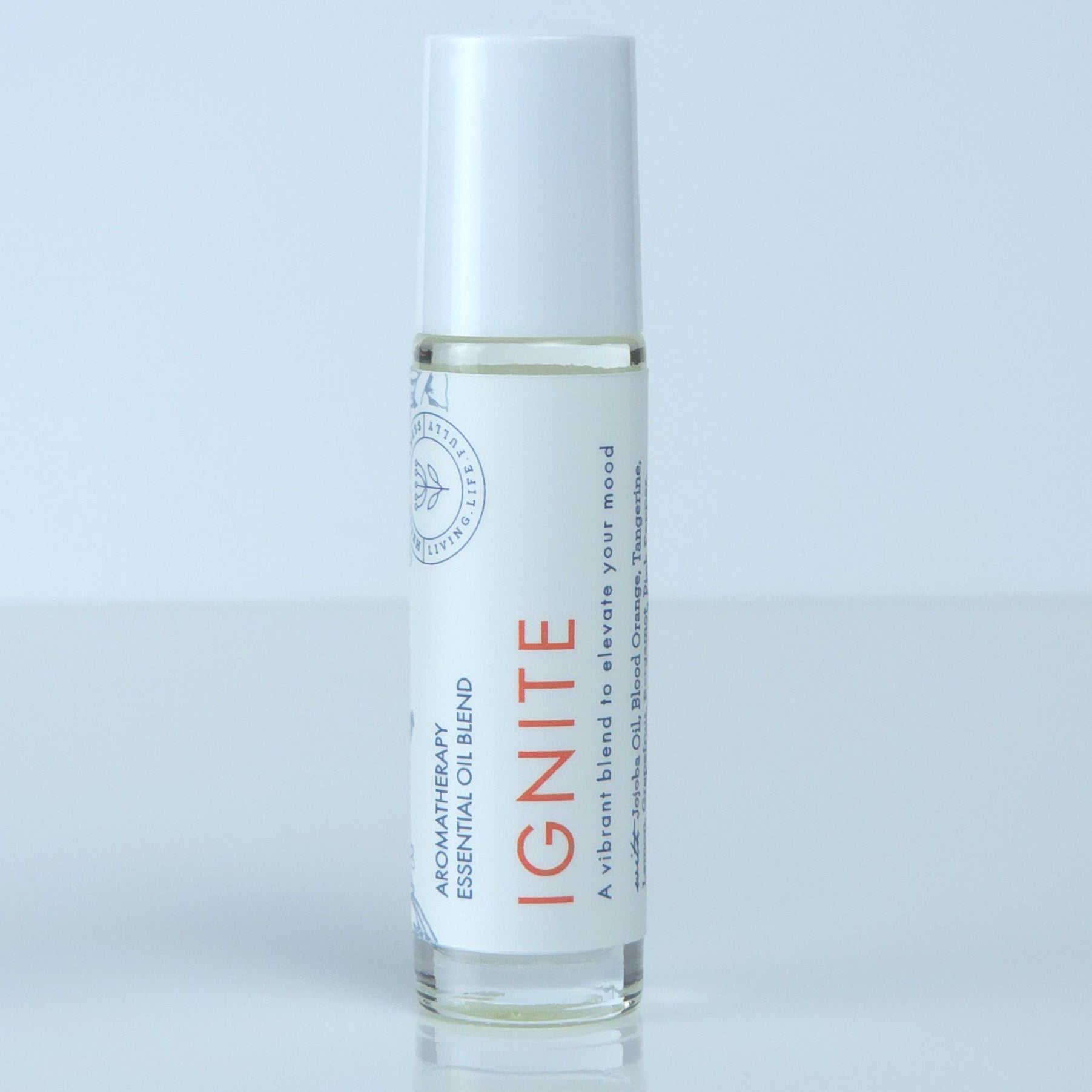 Roll-on bottle labeled 'IGNITE' for mood boost on a light gray background