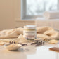 Jar of Magnolia + Lavender body butter on a white background