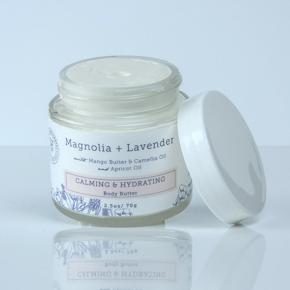 Jar of cream with a white lid on a light gray background