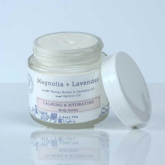 Jar of cream with a white lid on a light gray background