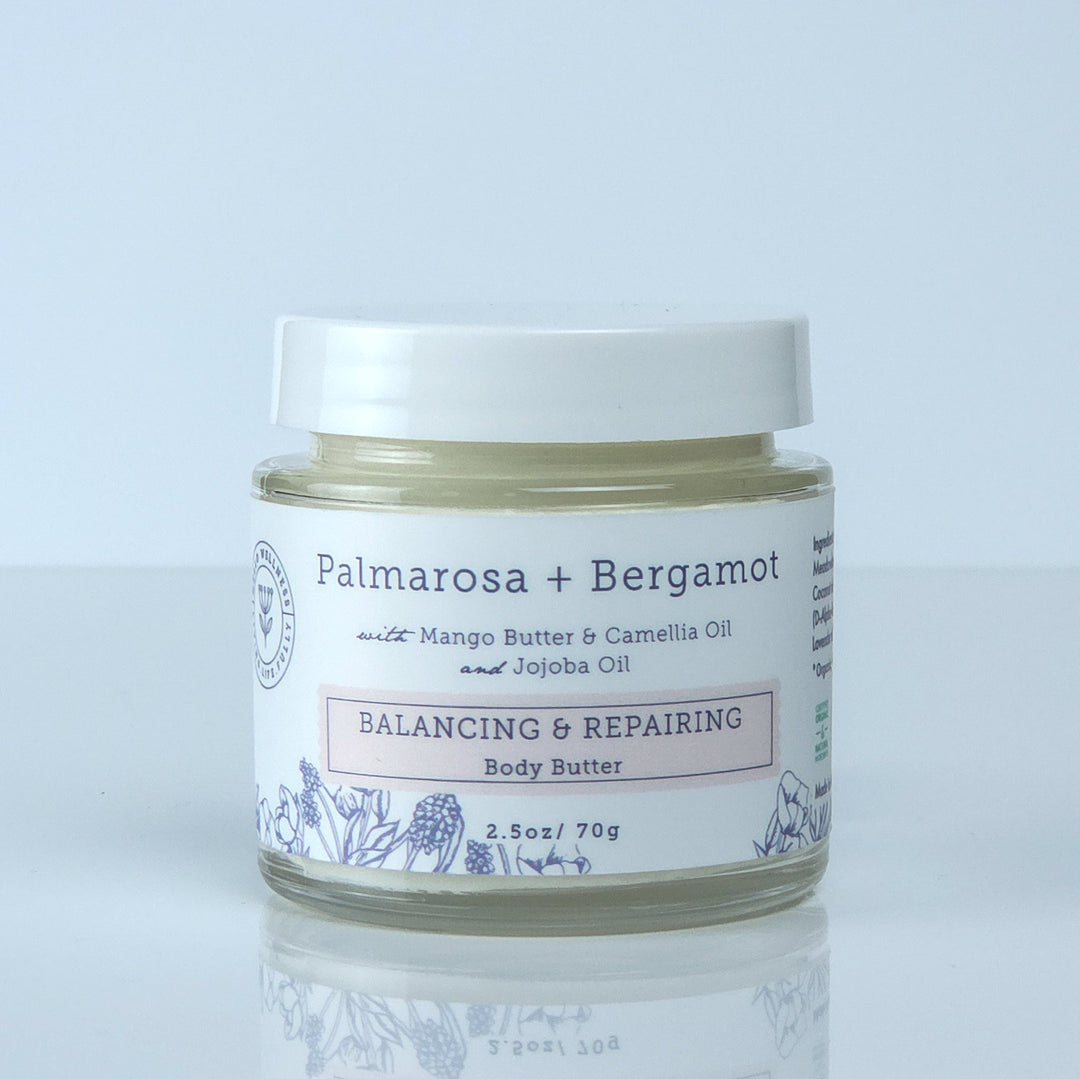 Jar of Palmarosa + Bergamot body butter on a light gray background