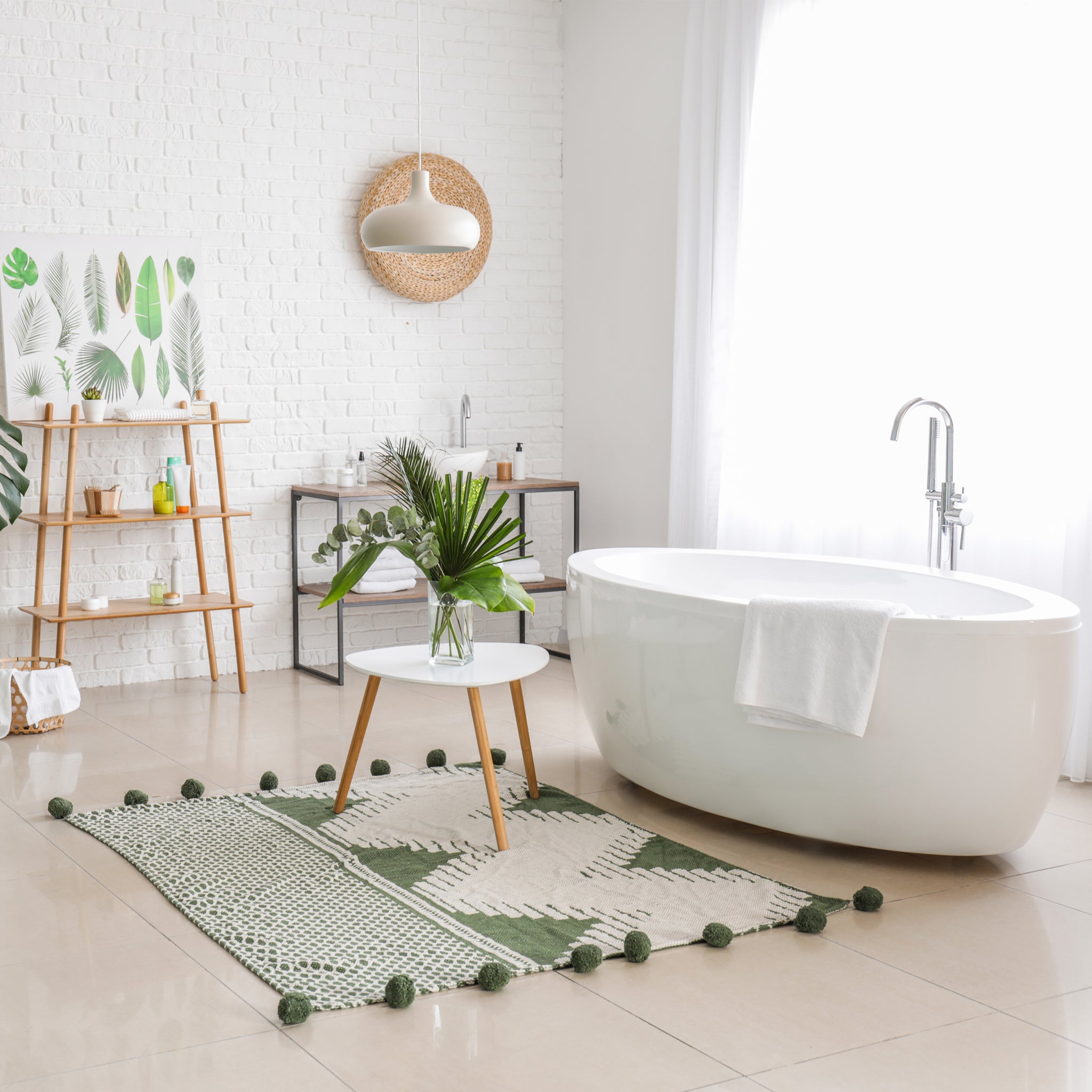 Airy, clean bathroom with white free standing tub. Perfect for soaking and relaxing